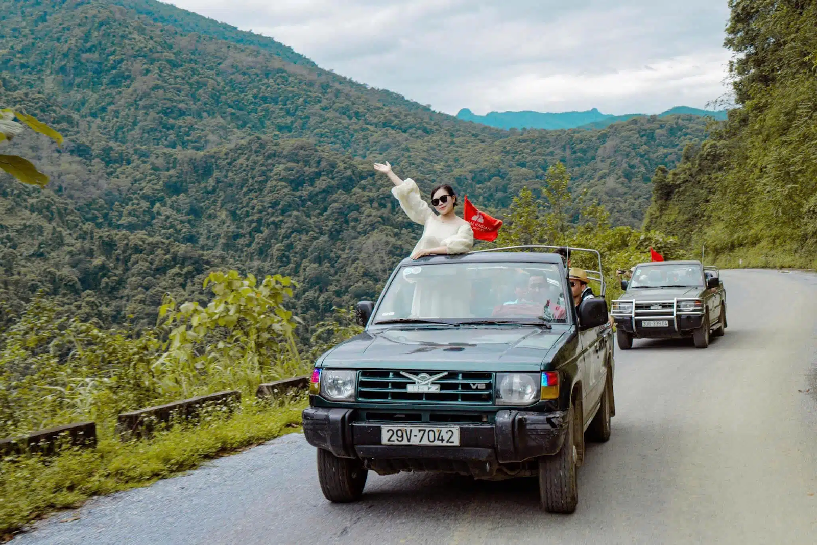 Ha Giang Jeep Tour from Hanoi - open-air jeep driving along mountain road in northern Vietnam