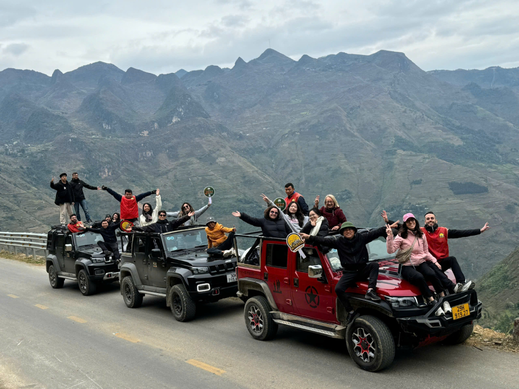 Ha Giang Jeep Tour for Couples and Families driving through Ma Pi Leng Pass, capturing shared silence and mountain connection. 