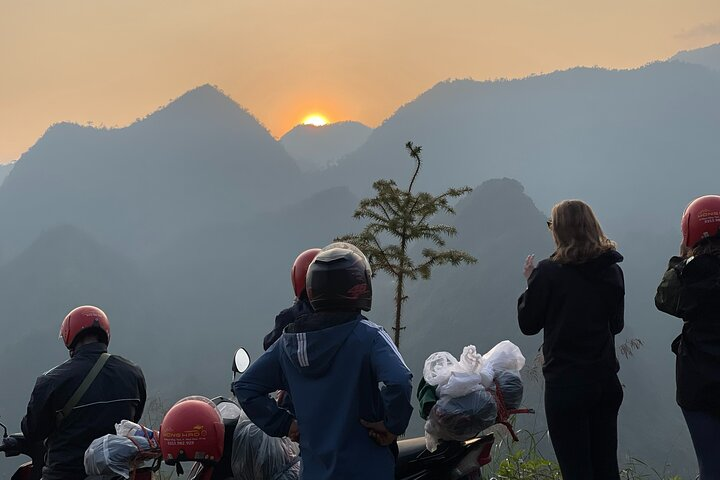 Ha Giang motorbike road through limestone mountains at sunrise, symbolizing eight quiet roads of the Ha Giang Self Ride Motorbike Tour.