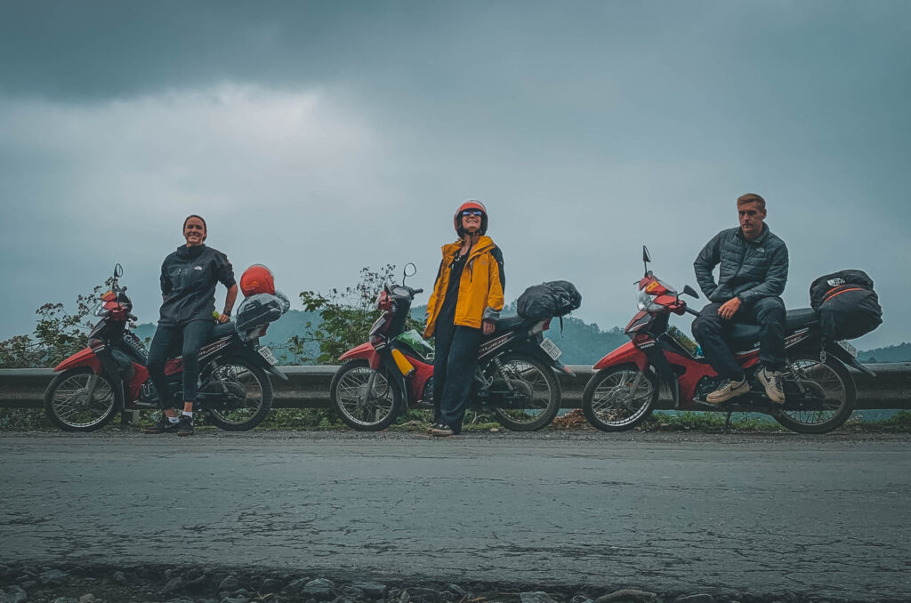 Motorbike rider on Ma Pi Leng Pass overlooking Nho Que River during Ha Giang Self Ride Motorbike Tour.