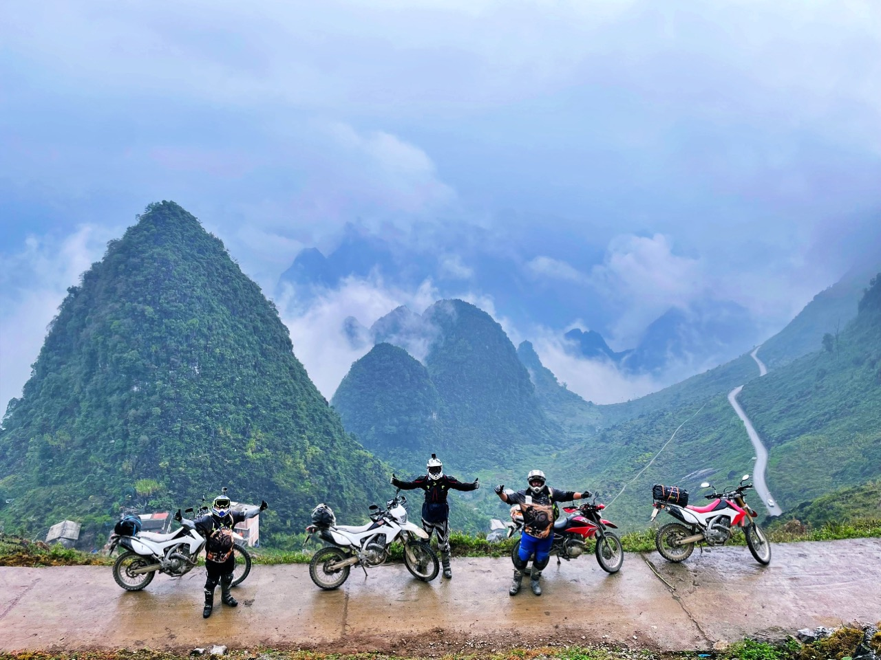 Ha Giang motorbike road through limestone mountains at sunrise, symbolizing eight quiet roads of the Ha Giang Self Ride Motorbike Tour.