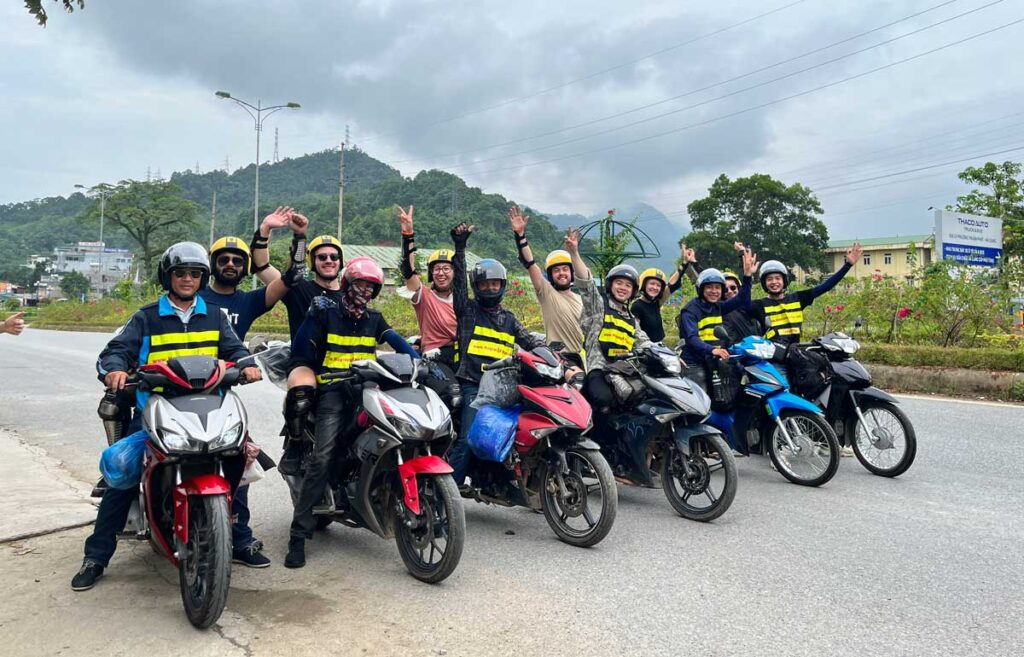 Travelers checking motorbike gear before starting the Ha Giang Loop Motorbike Tour.
