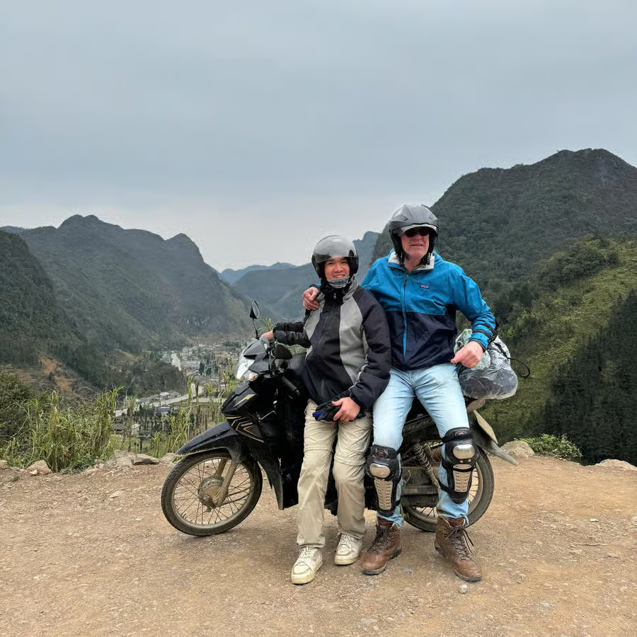Motorbike riders follow a local guide through the Ha Giang Loop’s mountain roads during a Ha Giang Easy Rider Tour.
