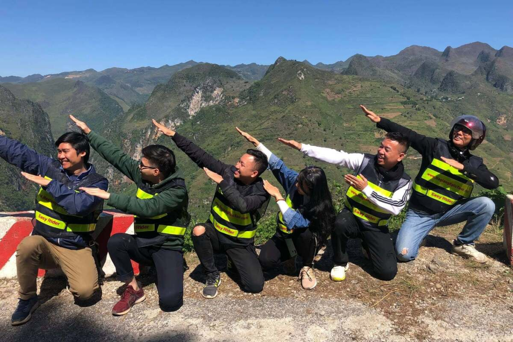 QT Motorbikes & Tours Easy Rider guide checks safety gear with travelers before starting the Ha Giang Easy Rider Tour