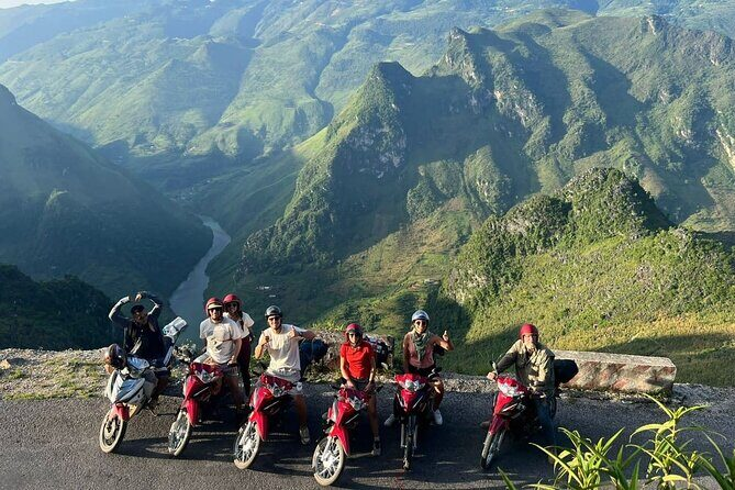 Local guide from QT Motorbikes & Tours talking with ethnic villagers in Ha Giang.