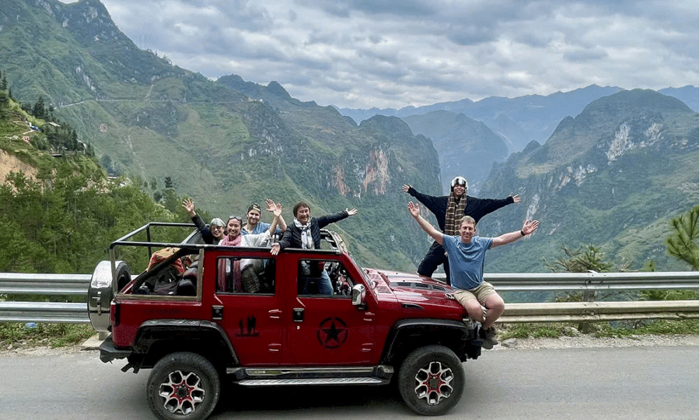 Local driver guiding Jeep through Ma Pi Leng Pass, Ha Giang Loop, Vietnam’s northern mountains.