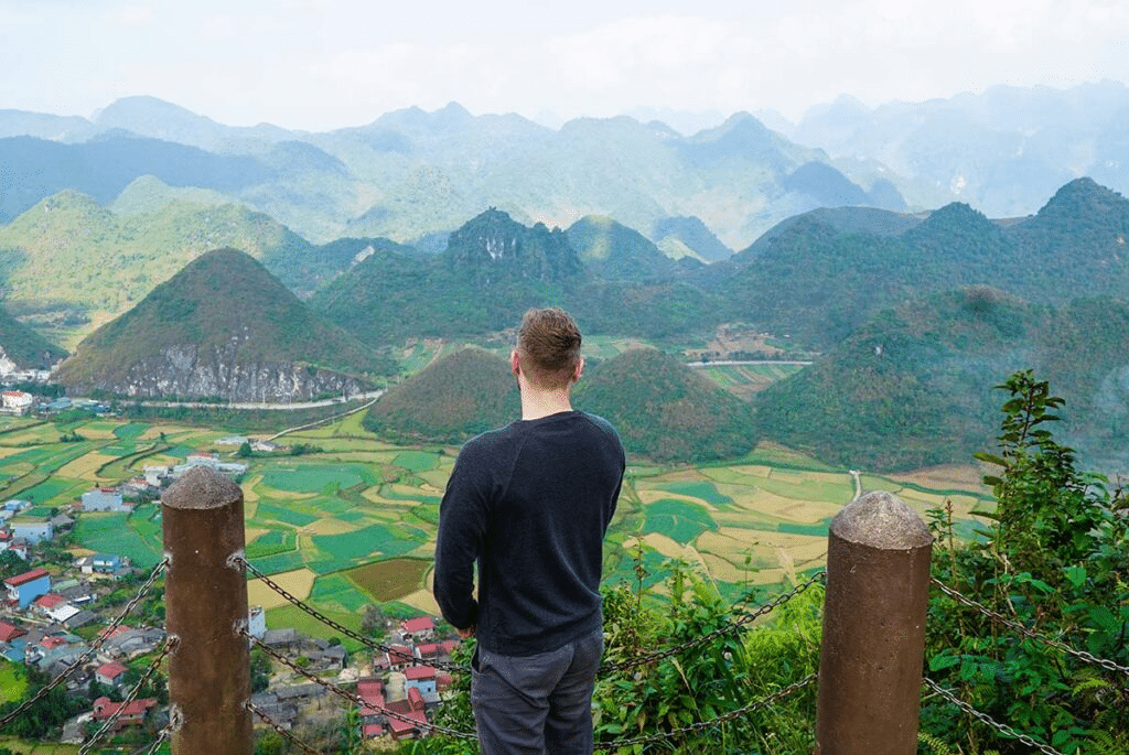 Jeep overlooking Ha Giang mountains at sunset during Private Ha Giang Jeep Tour